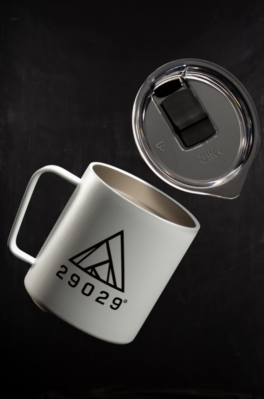 White on the go mug with black logo lockup in black on the front center