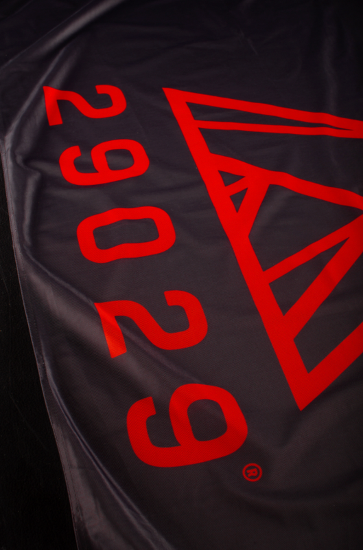 29029 flags in red with black logo or black flag with red logo.