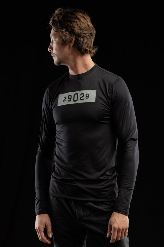 Black long sleeve performance men's tee with a boxed 29029 numeric logo on the center chest in silver. 